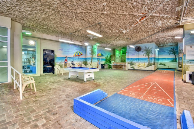 surrounding community with shuffleboard and pool table