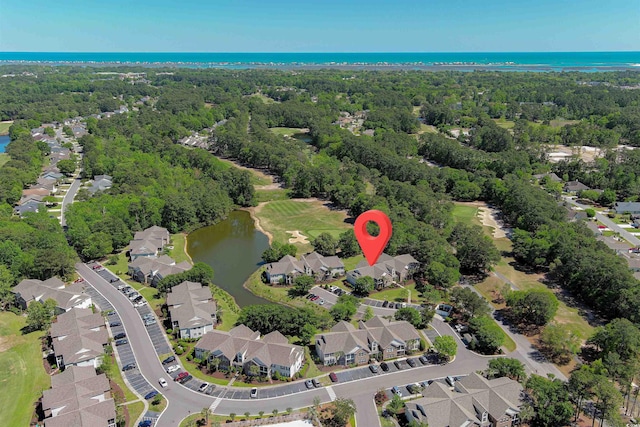 birds eye view of property with a water view, a forest view, and a residential view
