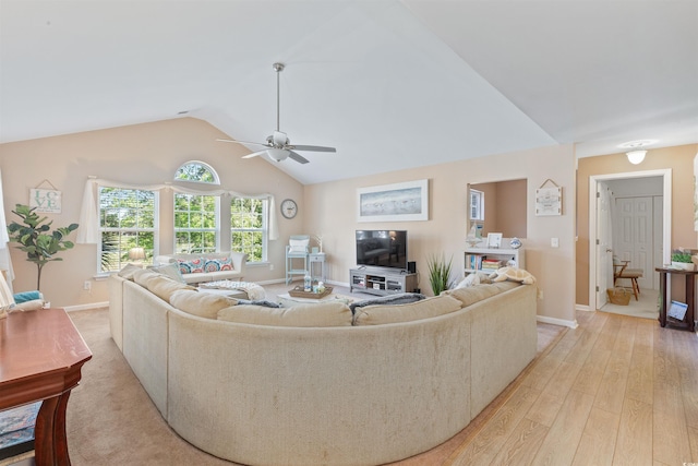 living room featuring light wood-type flooring, vaulted ceiling, baseboards, and ceiling fan