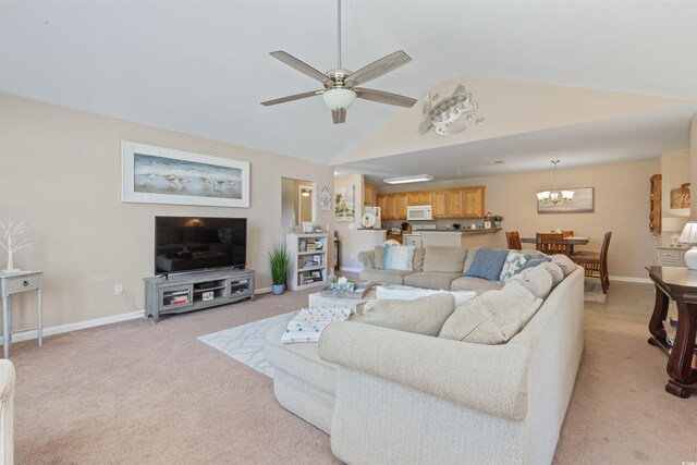 living room featuring lofted ceiling, baseboards, light colored carpet, and ceiling fan with notable chandelier