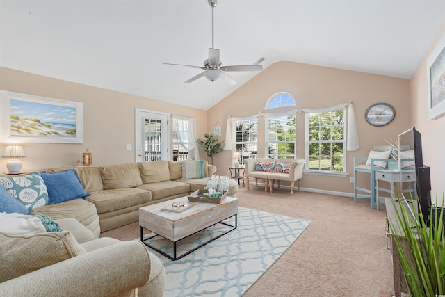 living area with a ceiling fan, baseboards, light colored carpet, and vaulted ceiling