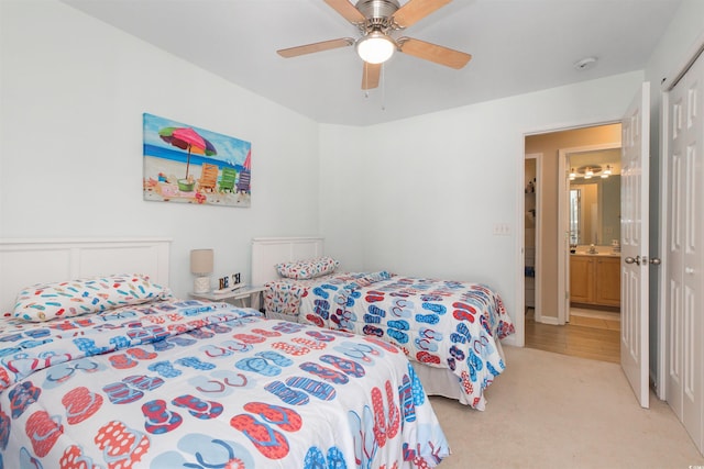 bedroom with light carpet, a closet, and a ceiling fan