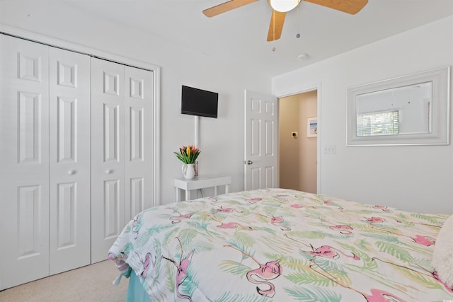 bedroom with carpet flooring, a closet, and a ceiling fan