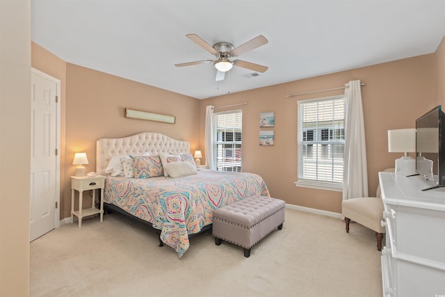 bedroom with light colored carpet, visible vents, and baseboards