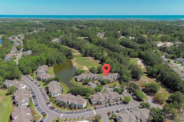 drone / aerial view with a water view and a residential view