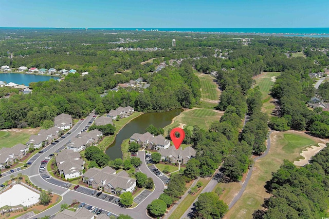 bird's eye view with view of golf course, a water view, a residential view, and a view of trees