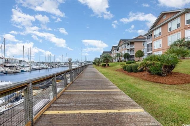exterior space with a yard and a water view