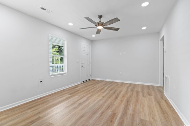 spare room featuring a ceiling fan, recessed lighting, baseboards, light wood finished floors, and visible vents