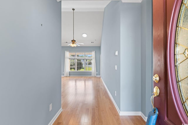 entrance foyer featuring light wood finished floors, baseboards, and ceiling fan