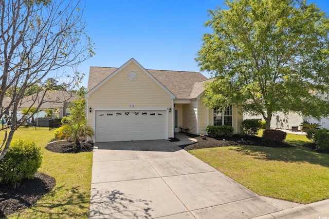 view of front of property featuring an attached garage, concrete driveway, and roof with shingles