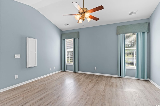 unfurnished room with ceiling fan, wood finished floors, lofted ceiling, and baseboards