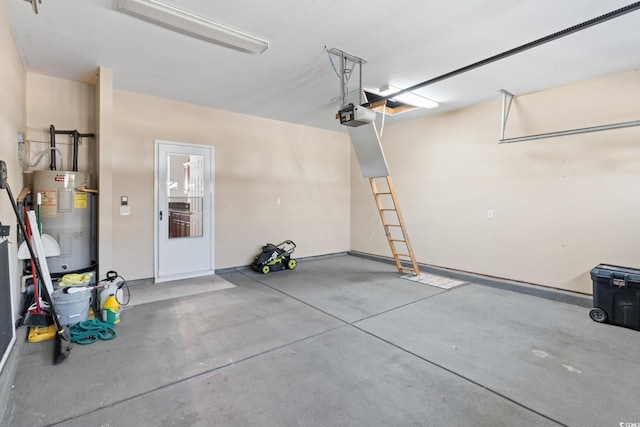 garage with water heater, a garage door opener, and baseboards
