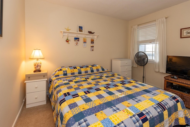 carpeted bedroom with baseboards