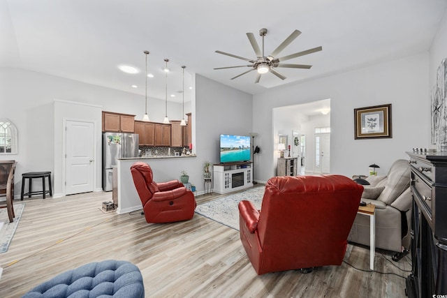 1208 Camlet Ln, Little River, SC 29566 - living room with ceiling fan, light wood-style flooring, high vaulted ceiling, and baseboards