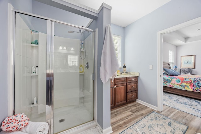 1208 Camlet Ln, Little River, SC 29566 - full bathroom featuring wood finished floors, connected bathroom, a stall shower, and baseboards