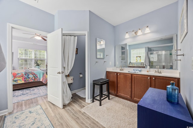 1208 Camlet Ln, Little River, SC 29566 - full bathroom with wood finished floors, a shower stall, double vanity, ensuite bathroom, and a ceiling fan