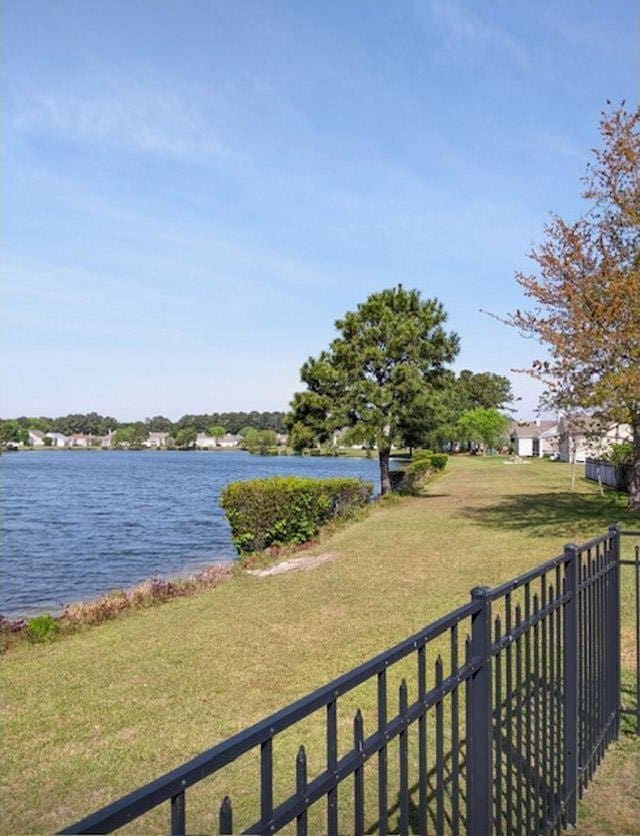 view of water feature featuring fence