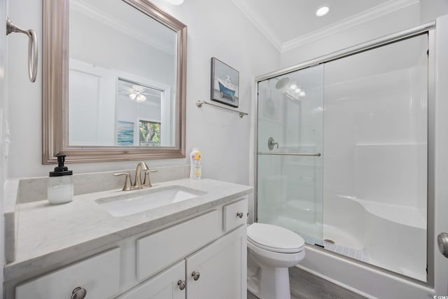 2602 Holly Dr, North Myrtle Beach, SC 29582 - full bathroom with vanity, ornamental molding, a shower stall, toilet, and wood finished floors