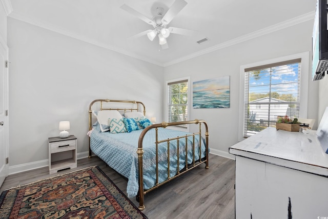 2602 Holly Dr, North Myrtle Beach, SC 29582 - bedroom with crown molding, wood finished floors, baseboards, and ceiling fan