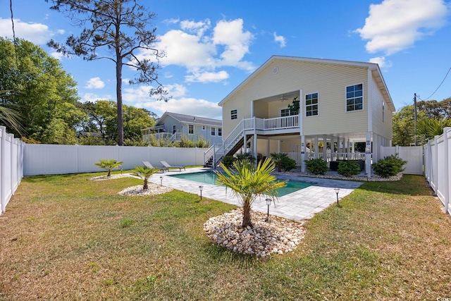 2602 Holly Dr, North Myrtle Beach, SC 29582 - back of property featuring a ceiling fan, stairs, and a patio
