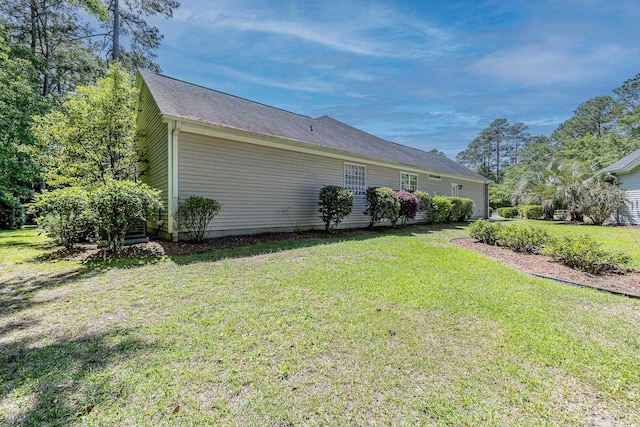 exterior space with a yard and an attached garage