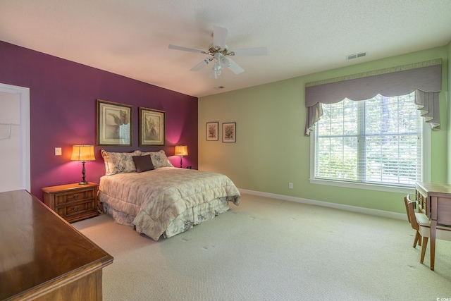 bedroom featuring carpet, a ceiling fan, and baseboards