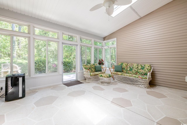 sunroom / solarium featuring a ceiling fan