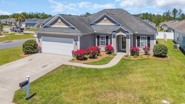 1512 Virginia Pine Dr, Longs, SC 29568 - traditional-style home featuring a garage, driveway, a shingled roof, and central AC unit