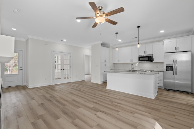 kitchen featuring appliances with stainless steel finishes, crown molding, ceiling fan, light countertops, and recessed lighting
