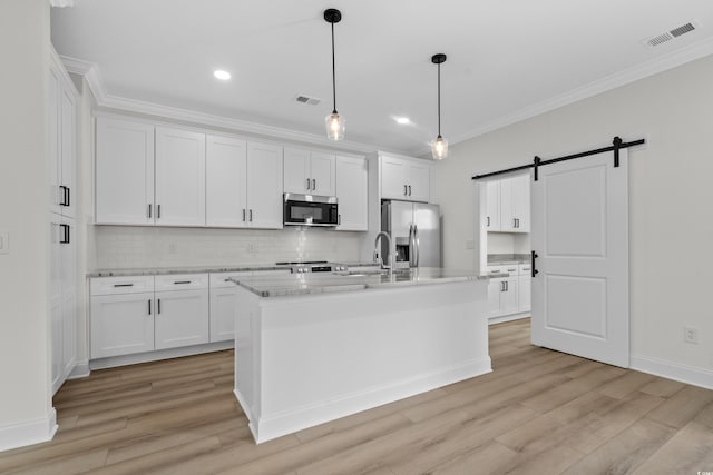 135 Stonewall Cir Unit 7-2, Longs, SC 29568 - kitchen featuring stainless steel appliances, crown molding, a barn door, tasteful backsplash, and white cabinets