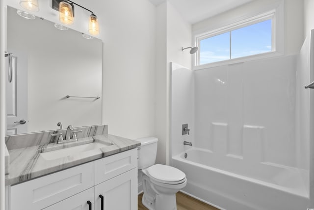 full bathroom with toilet, vanity, bathtub / shower combination, and wood finished floors