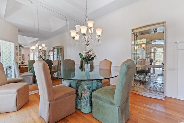321 Heather Ct, Sunset Beach, NC 28468 - dining room featuring ornamental molding, wood finished floors, and a chandelier