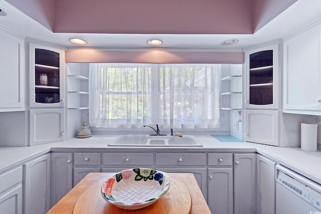 321 Heather Ct, Sunset Beach, NC 28468 - kitchen with a sink, gray cabinetry, dishwasher, and glass insert cabinets