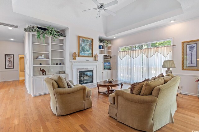 321 Heather Ct, Sunset Beach, NC 28468 - living room with a premium fireplace, recessed lighting, ceiling fan, and light wood-type flooring