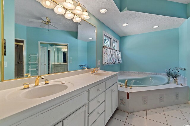 321 Heather Ct, Sunset Beach, NC 28468 - bathroom featuring tile patterned floors, a textured ceiling, a bath, and a sink