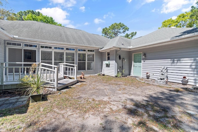 321 Heather Ct, Sunset Beach, NC 28468 - back of house featuring roof with shingles
