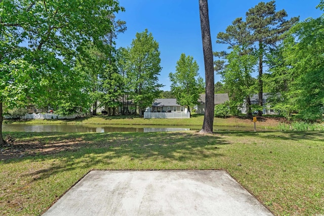 622 Oakhurst Dr, Myrtle Beach, SC 29579 - view of green lawn with a water view and a patio area