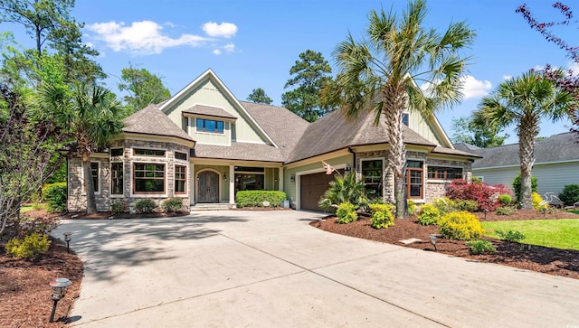 8008 Mcsweeney Ct, Myrtle Beach, SC 29588 - view of front facade with an attached garage, driveway, and stone siding