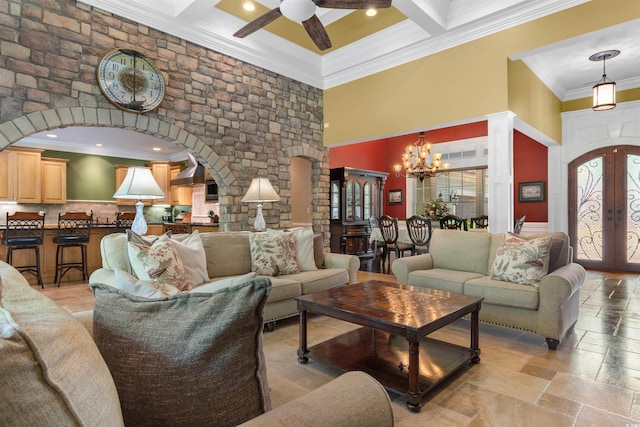 8008 Mcsweeney Ct, Myrtle Beach, SC 29588 - living area with crown molding, a high ceiling, arched walkways, ceiling fan with notable chandelier, and beamed ceiling