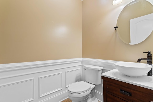 8008 Mcsweeney Ct, Myrtle Beach, SC 29588 - bathroom featuring toilet, wainscoting, and vanity