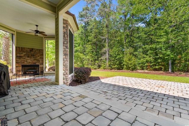 8008 Mcsweeney Ct, Myrtle Beach, SC 29588 - view of patio with a ceiling fan and an outdoor stone fireplace