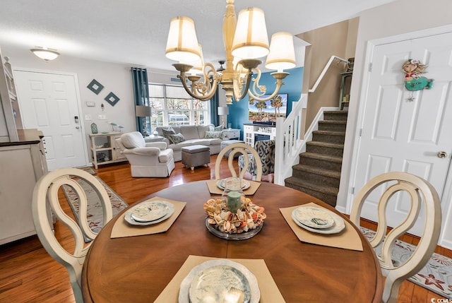 1046 Palisade Cir Unit 1046, Myrtle Beach, SC 29577 - dining room with a chandelier, wood finished floors, and stairs