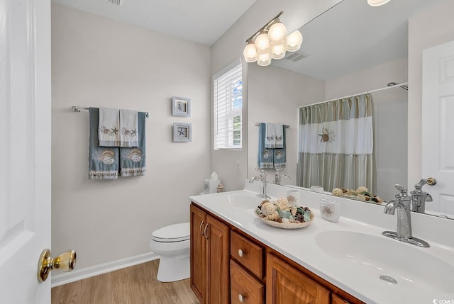 1046 Palisade Cir Unit 1046, Myrtle Beach, SC 29577 - full bathroom featuring toilet, wood finished floors, double vanity, baseboards, and curtained shower