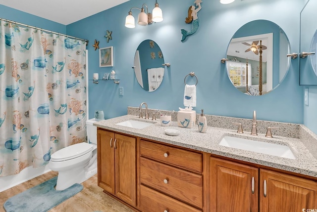 1046 Palisade Cir Unit 1046, Myrtle Beach, SC 29577 - bathroom with double vanity, toilet, a ceiling fan, and shower / bath combination with curtain