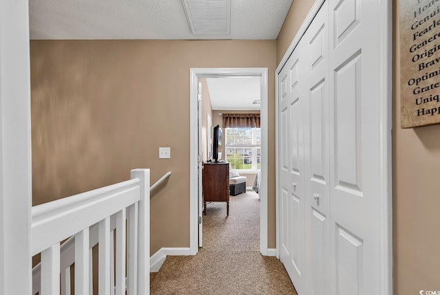 1046 Palisade Cir Unit 1046, Myrtle Beach, SC 29577 - hallway with carpet floors, an upstairs landing, baseboards, and a textured ceiling