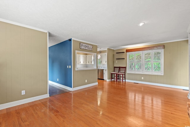 5033 Brantwood Dr, Mullins, SC 29574 - unfurnished living room featuring visible vents, baseboards, light wood-style floors, and ornamental molding