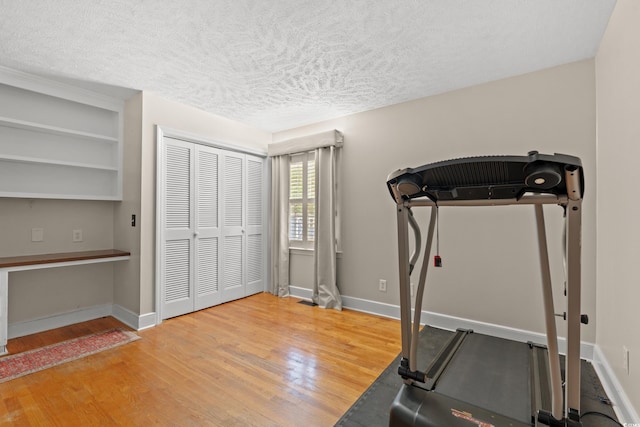 5033 Brantwood Dr, Mullins, SC 29574 - workout room with baseboards, wood finished floors, and a textured ceiling