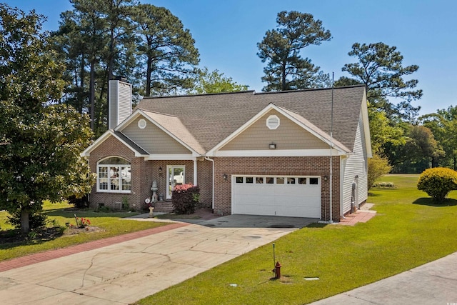 view of front of property with driveway, a chimney, a garage, brick siding, and a front yard