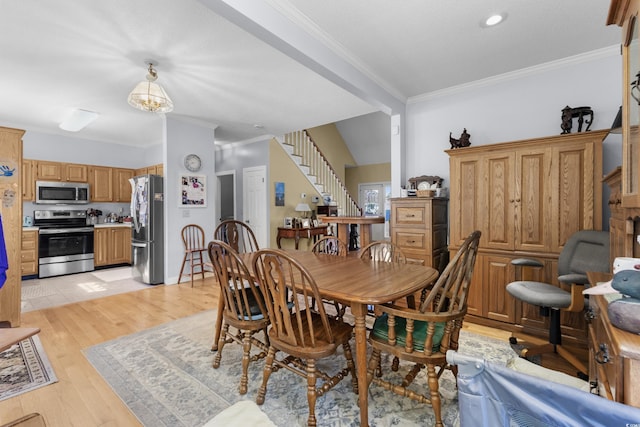 dining space with crown molding, stairs, light wood finished floors, and recessed lighting