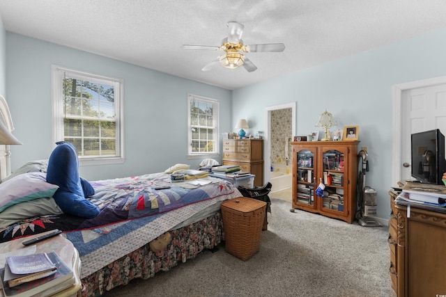 bedroom with ceiling fan and carpet floors